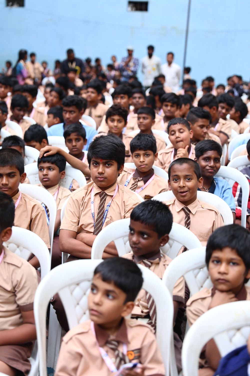 Students seated together at a school assembly
