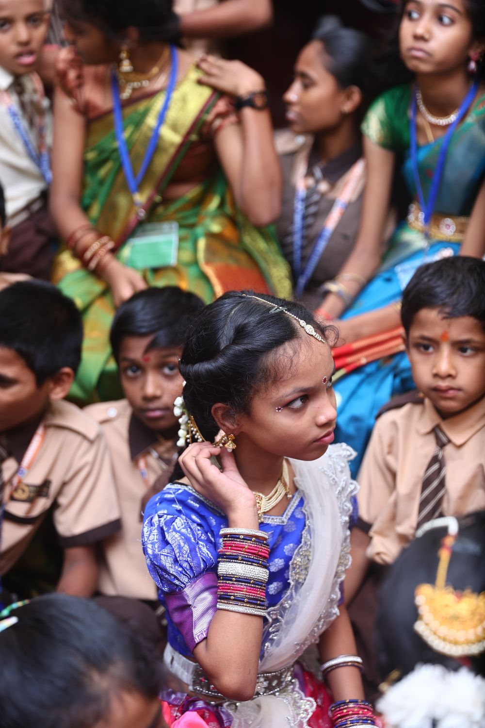 Students in traditional dress at a cultural programme
