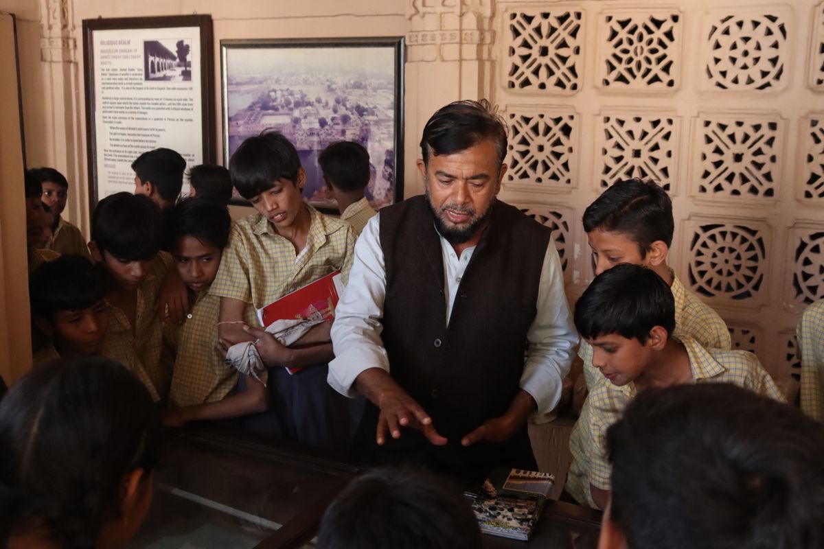 Students listening to a guide on an educational heritage visit